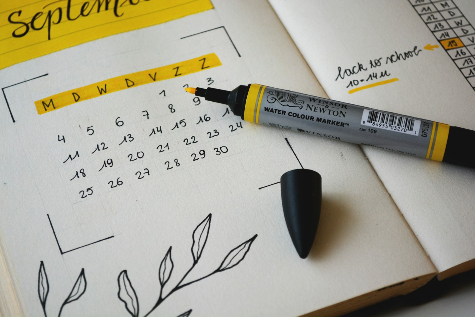 Monthly calendar with a marker ready for weekly planning